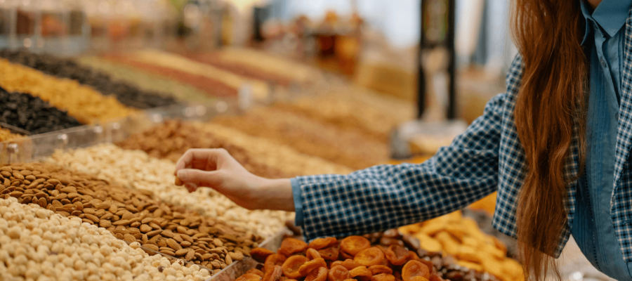 A girl shopping for Dry Fruits